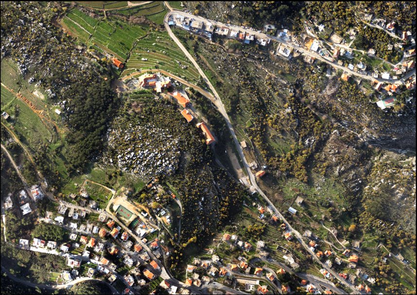 Aerial view of a roadway corridor through mountainous terrain