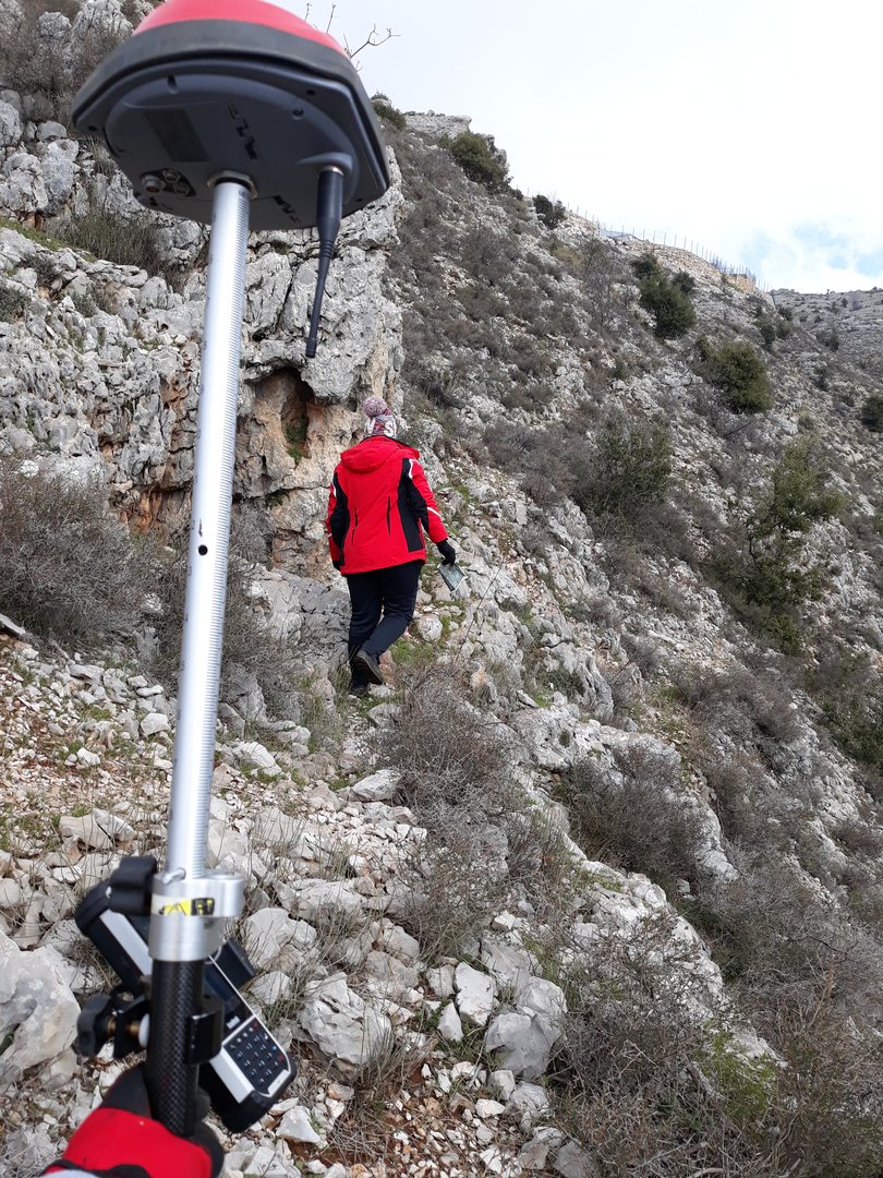Field surveying in mountainous terrain representing surveying project experience