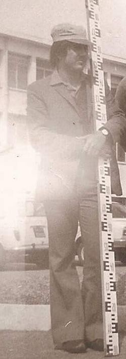Archival photograph of Rizkallah Aylo conducting field surveying work